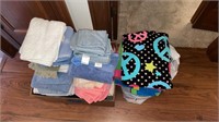 Box full of bath towels & bag of beach towels