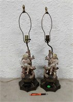 Pr Porcelain Putti Figural Lamps; damage issues