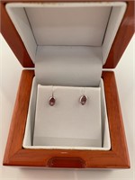 Pair of 14k padparadscha sapphire earrings