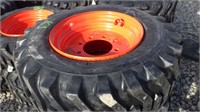 4 Unused 12-16.5 SKS332 tires on Bobcat wheels