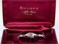 14k White gold Bulova diamond ladies watch.