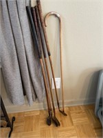 4 wooden golf clubs & cane