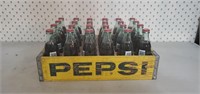 Pepsi Cola crate of Coca Cola soda bottles