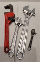 Assorted adjustable wrenches and pipe wrench