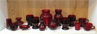 Shelf lot of dark red glassware