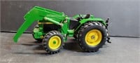 John Deere Metal & Plastic Toy Tractor. Size is