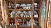 3 shelves in the China cabinet that includes