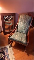 Small rocking chair with a wall mirror with