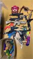 Box of toy guns,, includes two gun holsters, and
