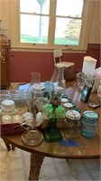 Oil lamps, antique jars and glasses