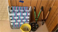 Lawnchair, shears and bolt cutter with yard and