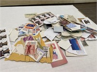 Assortment of United STates Stamps on Paper
