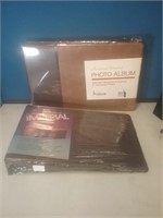 Group of three new photo albums sealed in plastic