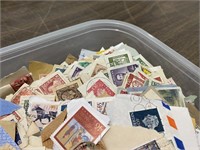 Container of Worldwide Stamps on paper