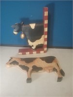 Pair of wooden cow decorations