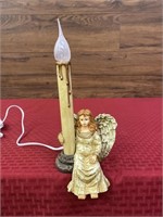 Angel lighted candle