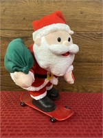 Animatronic skateboarding Santa Claus
