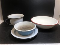 Enamelware plates, bowls and a pot.