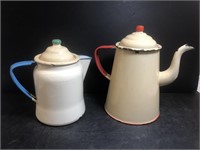 Two enamelware kettles.