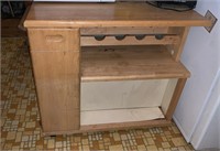 Kitchen island, with a wood cutting board top,