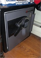 Small Sentury brand floor safe, with a push