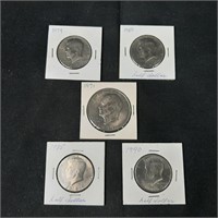 US Dollar Coin and 4 Half Dollars