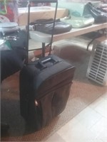 Black Rolling travel suitcase should fit in an