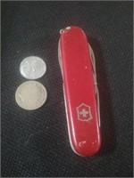 Swiss army knife and 2 vintage coins