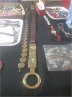 Group of two belts one is say replica coin belt