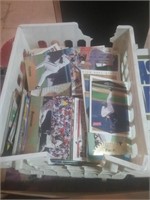 White plastic crate of vintage baseball cards