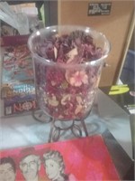 Glass candle holder filled with potpourri