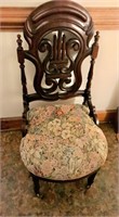 Antique Parlor Chair with Rollers on Front