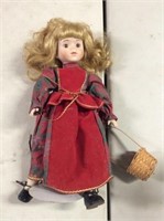 Porcelain Christmas doll with stand