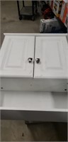 Small white cabinet for above the sink or toilet