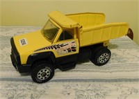 yellow Tonka truck metal top plastic bottom