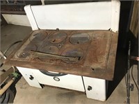 Antique wood stove with stand