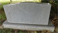 Granite headstone on base: