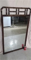 Wall mirror with bamboo frame.