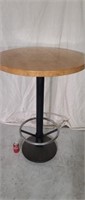 Round oak 30" bar height table w/ foot rest.