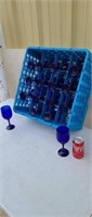 16 blue stem wine glasses in plastic tray.