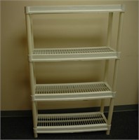 plastic shelving unit. 4 shelves