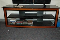 tv stand with glass shelves. contents not included