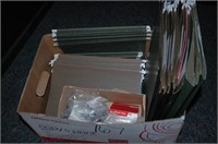 green hanging folders with tabs