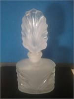 Satin glass in clear perfume bottle with glass