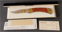 Buck model 110 knife gold etched red tailed hawk