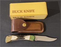 Buck Stag Handled 110 Folding knife with leather