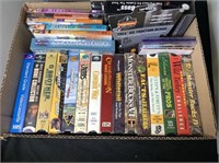 Box Lot: VHS Tapes, Trek Ice Traction Device,