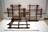 Three wooden wall-mount knickknack shelves