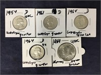 Four Quarters And A Kennedy Half Dollar With