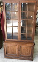 Two Piece, Glass Front Cabinet. Glass Shelves.